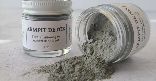 My Earth Potions Armpit Detox glass jar containing Bentonite Clay and Activated Charcoal powder for natural underarm detoxification